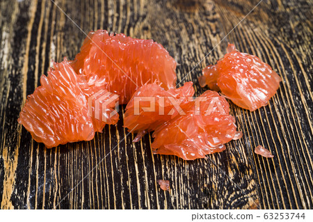 a piece of peeled grapefruit a piece of peeled grapefruit 63253744