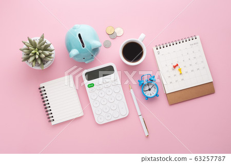 Calculator, piggy bank, calendar, clock and coin 63257787