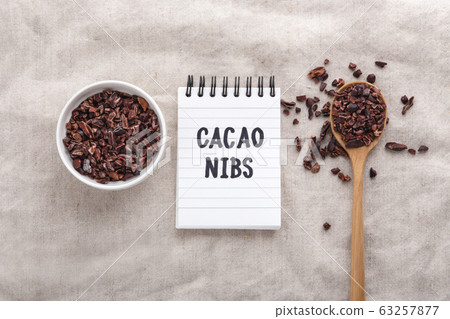 Cacao nibs in white bowl with handwritten note Cacao nibs in white bowl with handwritten note 63257877