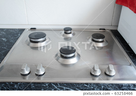 Polished gas cooker after washing.Perfectly clean Polished gas cooker after washing.Perfectly clean 63258466