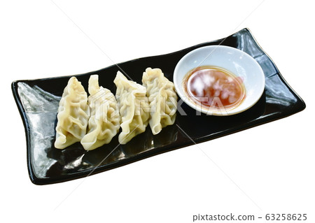 steamed Gyoza or Japanese dumpling stuffed minced pork dipping shoyu sauce on plate 63258625