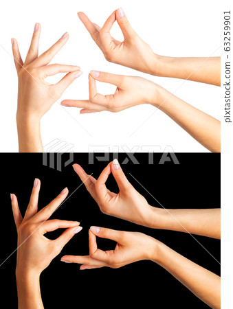 Woman hands showing picking up pose or holding 63259901