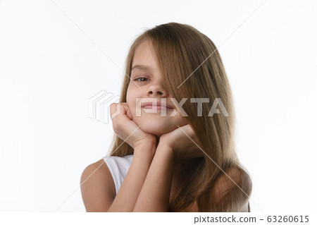 Portrait of a close-up of a girl covering part of Portrait of a close-up of a girl covering part of 63260615