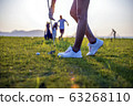 Woman golfer drop a golf ball in the rough area after lost of golf ball out of fairway 63268110