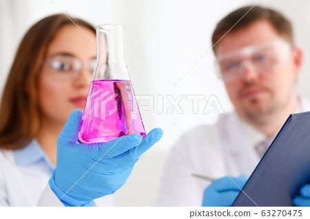 Female technician arms in protective gloves 63270475