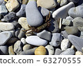 The crab, sensing danger, hides under a rock. On a Sunny day, the crab crawls out on the rocks to get warm. Black sea coast. 63270555