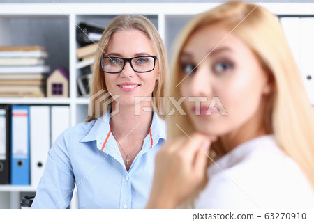 Group of people sit in office deliberate on problem 63270910