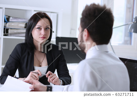 Beautiful brunette businesswoman portrait at workplace 63271711