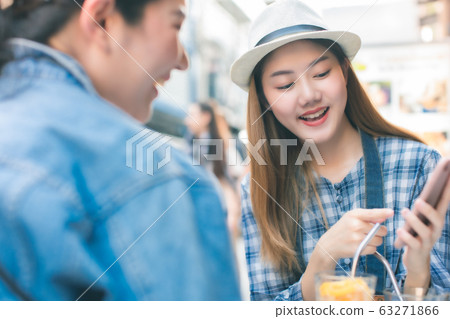 Young Asian female friends taking her vacation and Young Asian female friends taking her vacation and 63271866
