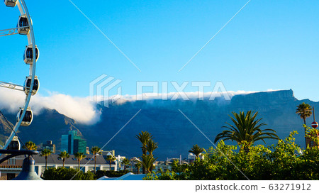 Table mountain with cloth view from V&A watefront at ferris wheel iconic landscape Cape Town Africa 63271912