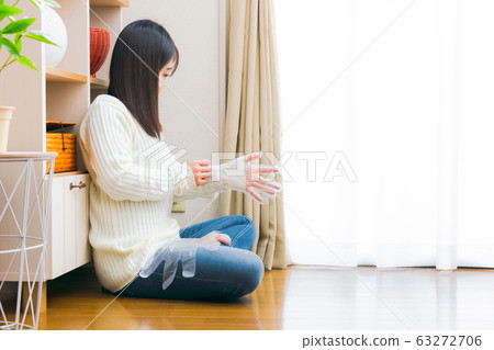 Woman wearing poly gloves copy space 63272706