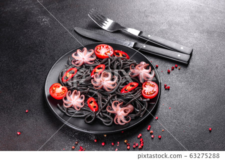Black seafood pasta with shrimp and octopus 63275288