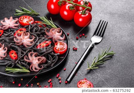 Black seafood pasta with shrimp and octopus 63275292