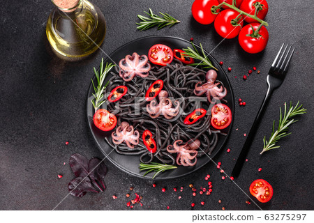 Black seafood pasta with shrimp and octopus 63275297