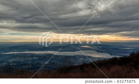 Cloudy sunset over the lake of Varese Cloudy sunset over the lake of Varese 63275875