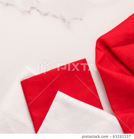Folded napkin and kitchen towel set on white marble background, table decor 63281537