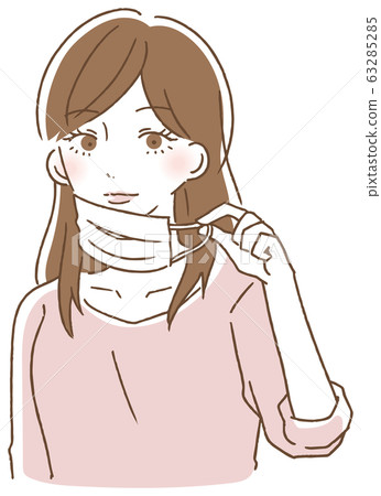 Woman holding a mask string and removing Woman holding a mask string and removing 63285285