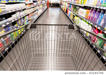 Shopping trolley cart moving in supermarket with motion blur Shopping trolley cart moving in supermarket with motion blur 63285746