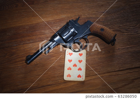 russian roulette - Nine of Hearts plaing card and 63286050