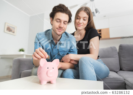 Home budget, family finance with piggy bank Home budget, family finance with piggy bank 63286132