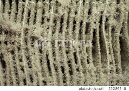 Dirty used air filter background Dirty used air filter background 63286546