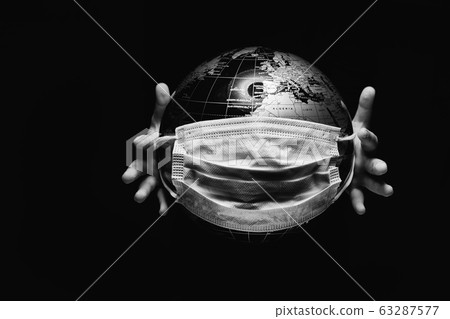 Hands of kid holding globe 63287577