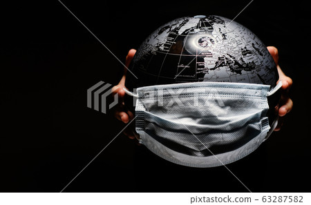 Hands of kid holding globe Hands of kid holding globe 63287582