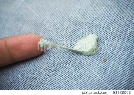 dirty stain from gum chewy on jean for cleaning concept dirty stain from gum chewy on jean for cleaning concept 63288068