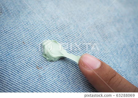dirty stain from gum chewy on jean for cleaning concept dirty stain from gum chewy on jean for cleaning concept 63288069