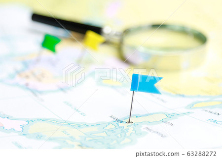 small color pin flag on map for travel or journey destination concept small color pin flag on map for travel or journey destination concept 63288272