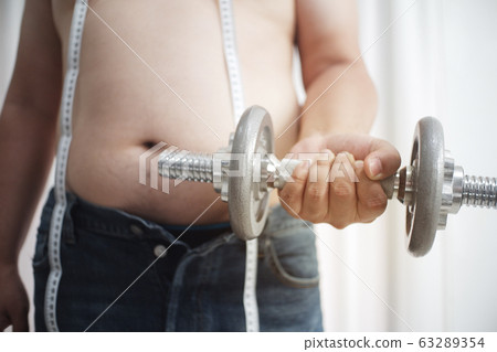 Fat men start exercising by lifting weights. Fat men start exercising by lifting weights. 63289354