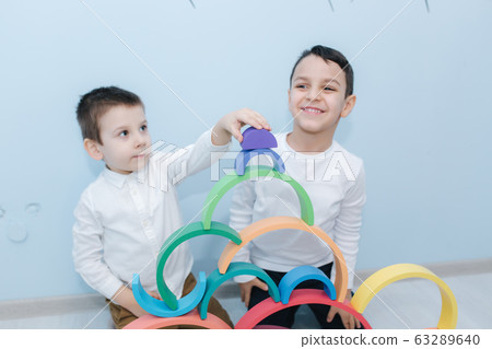 Boys play in different intelectual games in preschool classroom Boys play in different intelectual games in preschool classroom 63289640