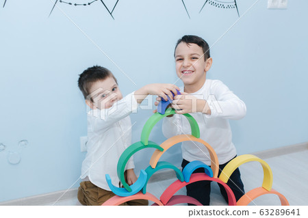 Boys play in different intelectual games in preschool classroom Boys play in different intelectual games in preschool classroom 63289641