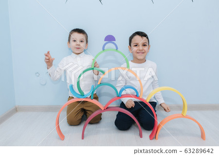 Boys play in different intelectual games in preschool classroom Boys play in different intelectual games in preschool classroom 63289642
