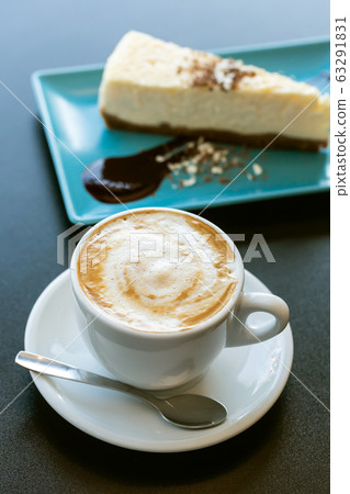 Cake and cappuccino coffee on the table Cake and cappuccino coffee on the table 63291831