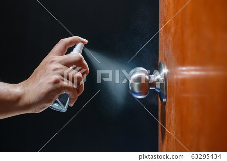 Cleaning door knob with alcohol spray for Cleaning door knob with alcohol spray for 63295434