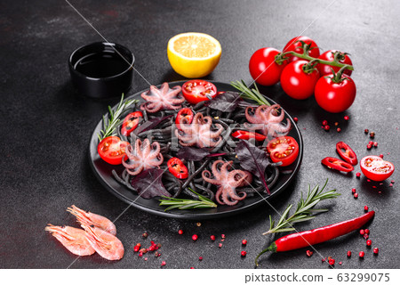 Black seafood pasta with shrimp and octopus 63299075