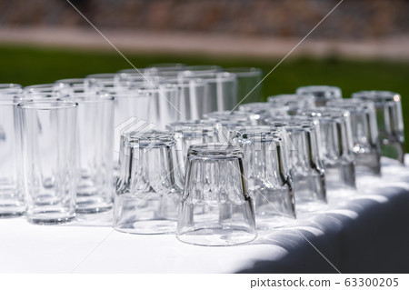 Set of blank empty wine glasses displayed in rows. Set of blank empty wine glasses displayed in rows. 63300205