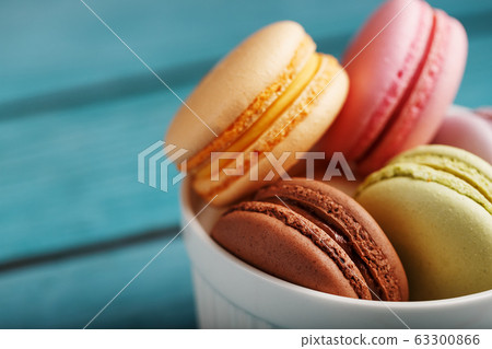 Macaroni cookies are placed in a white plate on a Macaroni cookies are placed in a white plate on a 63300866