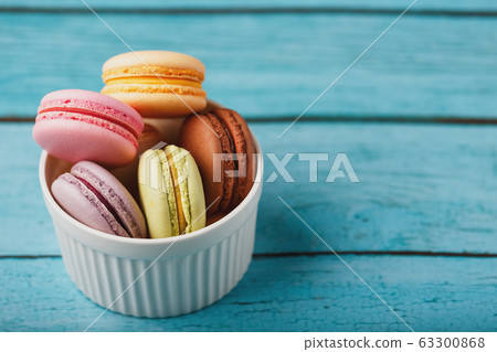 Macaroni cookies are placed in a white plate on a Macaroni cookies are placed in a white plate on a 63300868