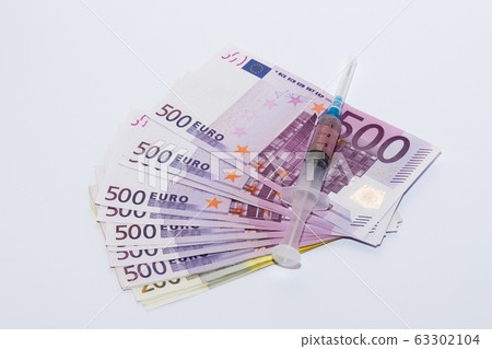 Syringe vaccine and euro bills. Expensive medicine concept. 63302104