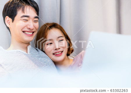 Bedroom couple newlyweds young men and women Bedroom couple newlyweds young men and women 63302263