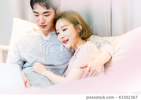 Bedroom couple newlyweds young men and women Bedroom couple newlyweds young men and women 63302367