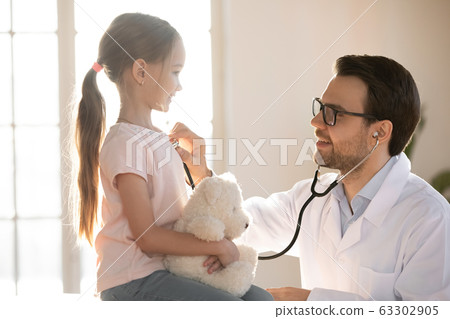 Little patient girl visiting pediatrician for checkup. 63302905
