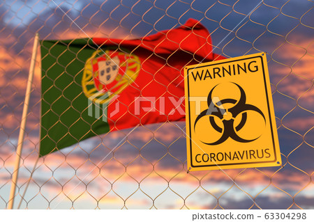 Coronavirus warning sign on the fence on the Portuguese flag background. Restricted entry or quarantine in Portugal. Conceptual 3D rendering 63304298