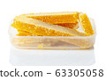 honey in honeycombs in a plastic box on a white 63305058