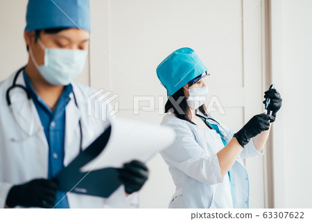 Scientists and doctors at work in laboratory. 63307622