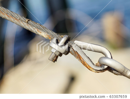 stainless steel turnbuckle hook and steel wire cable rope connection ties and connections concept. bracing and securing concept. stainless steel turnbuckle hook and steel wire cable rope connection ties and connections concept. bracing and securing concept. 63307659