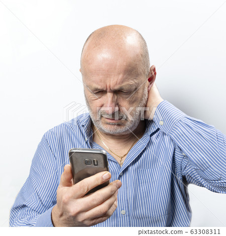 A middle aged man with cell phone A middle aged man with cell phone 63308311