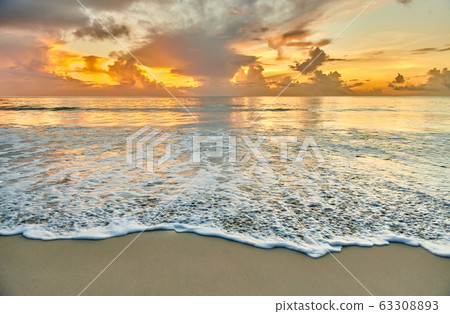 Beautiful sunset at Seychelles beach Beautiful sunset at Seychelles beach 63308893